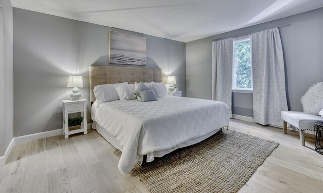 32 Sandy Reach Unit 32, Falmouth, MA 02536 - bedroom featuring light wood-style flooring and baseboards