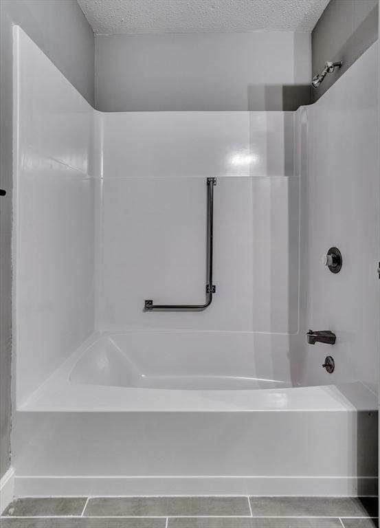 32 Sandy Reach Unit 32, Falmouth, MA 02536 - bathroom featuring a textured ceiling, bathtub / shower combination, and tile patterned flooring