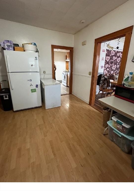 97-99 Gates St, Lowell, MA 01851 - kitchen featuring white appliances, light wood-style floors, and light countertops