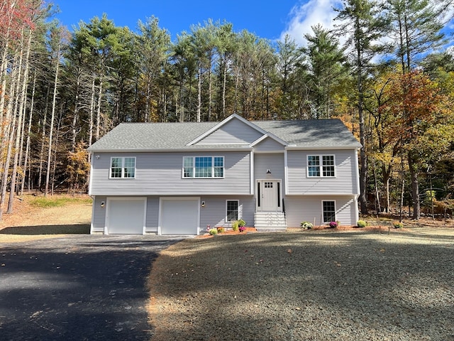 split foyer home featuring a garage