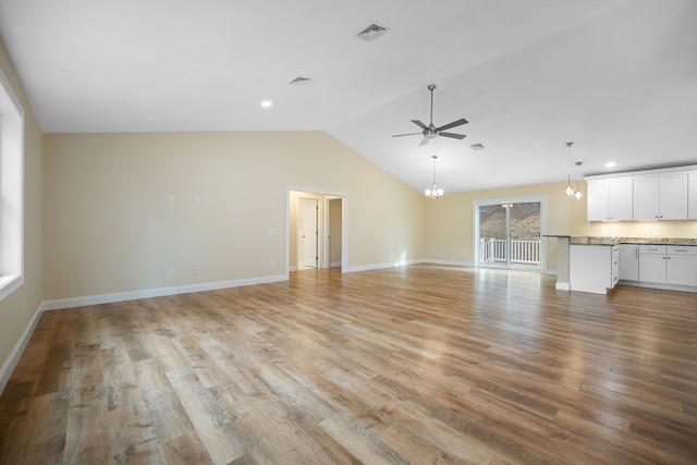 unfurnished living room featuring light wood-type flooring, ceiling fan, and lofted ceiling