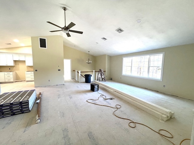 misc room featuring vaulted ceiling and ceiling fan with notable chandelier