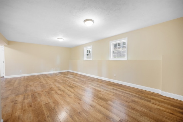 unfurnished room with light hardwood / wood-style flooring