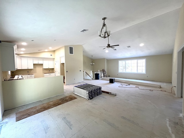 unfurnished living room with ceiling fan and high vaulted ceiling