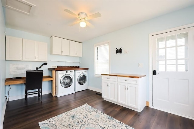 laundry room with washer and dryer, dark wood-type flooring, cabinet space, and a wealth of natural light