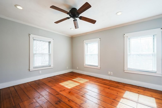 unfurnished room featuring crown molding, baseboards, recessed lighting, a ceiling fan, and wood-type flooring