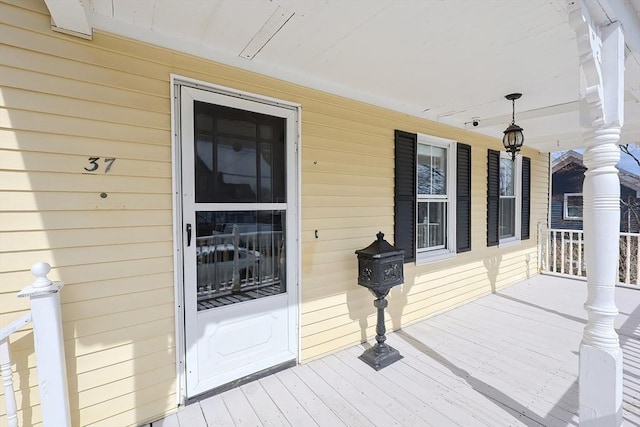 wooden terrace with a porch