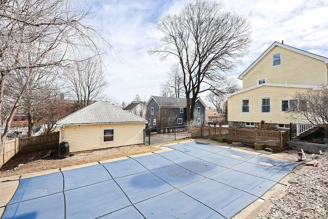 view of swimming pool with a patio area, a fenced in pool, a deck, and fence