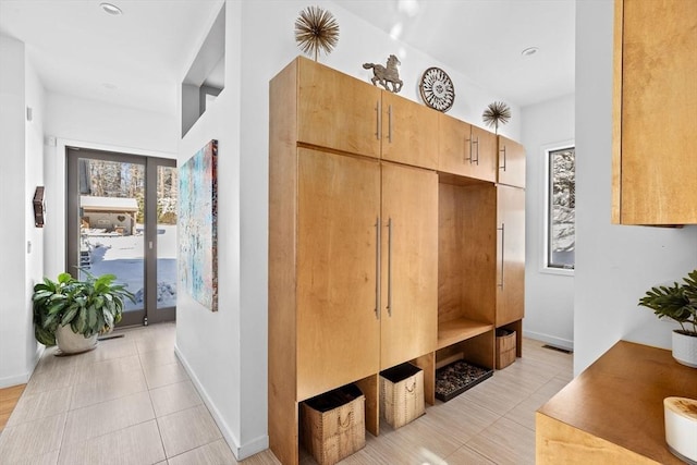 mudroom with light tile patterned floors