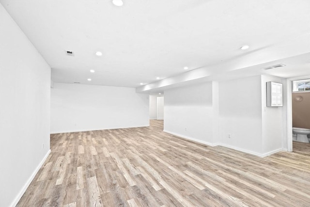 spare room with light wood-type flooring