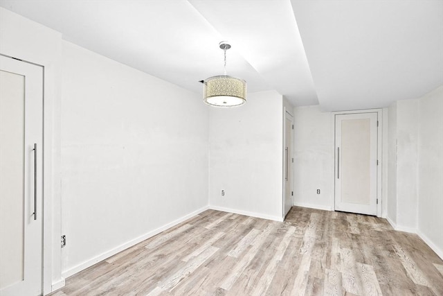 unfurnished dining area with light wood-type flooring