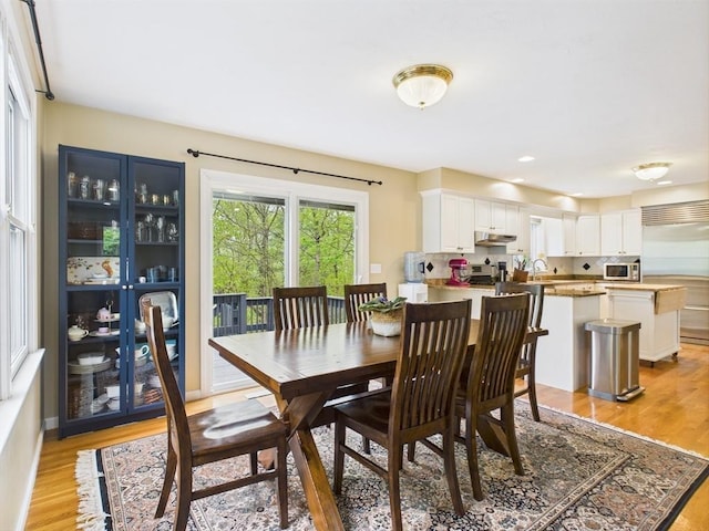 dining room with light wood-type flooring