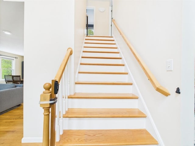 staircase with wood finished floors