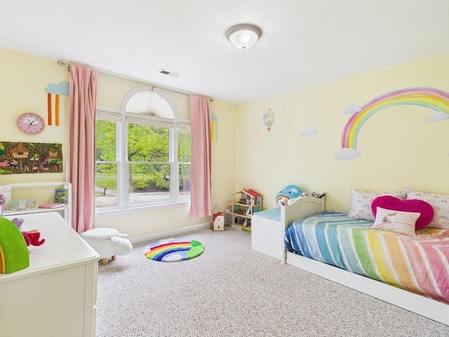 carpeted bedroom with baseboards