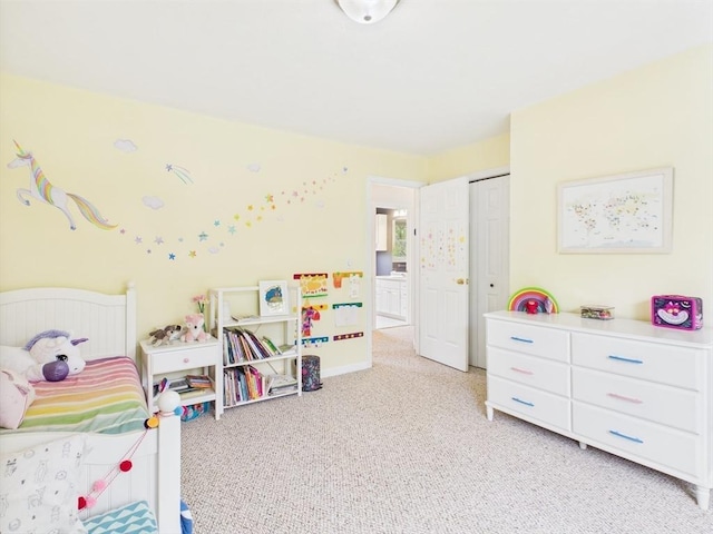 bedroom with light carpet and a closet