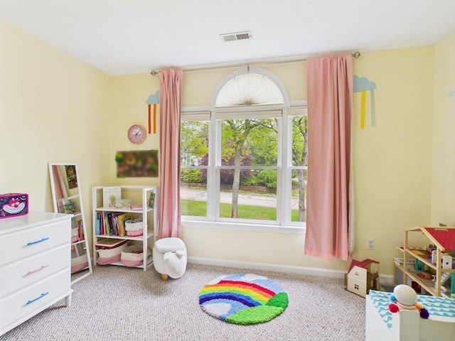 rec room featuring carpet flooring and baseboards