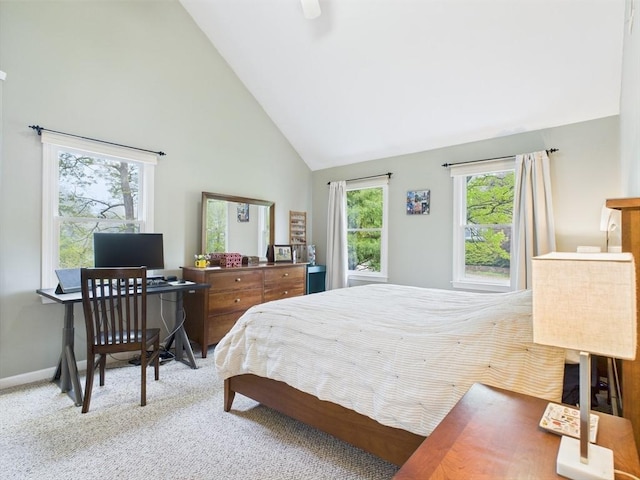 carpeted bedroom with high vaulted ceiling, baseboards, and a ceiling fan