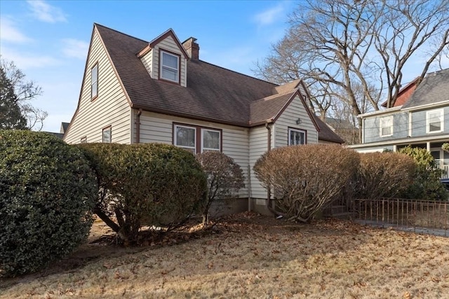 view of side of property featuring a lawn