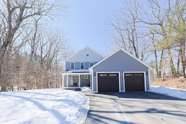 view of front of home featuring a garage and aphalt driveway