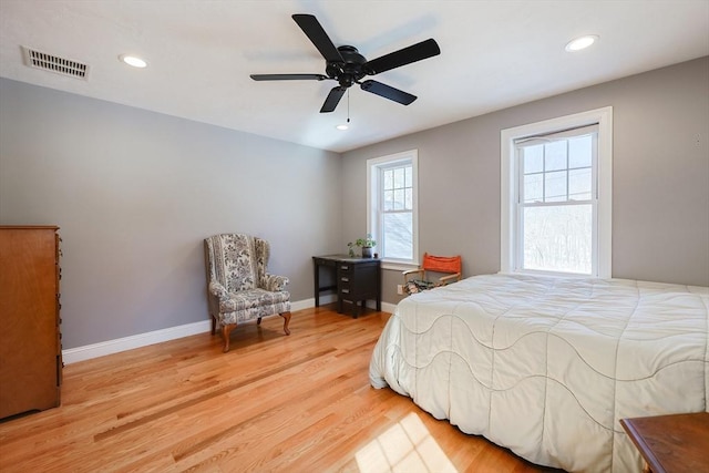 bedroom with recessed lighting, a ceiling fan, visible vents, baseboards, and light wood finished floors