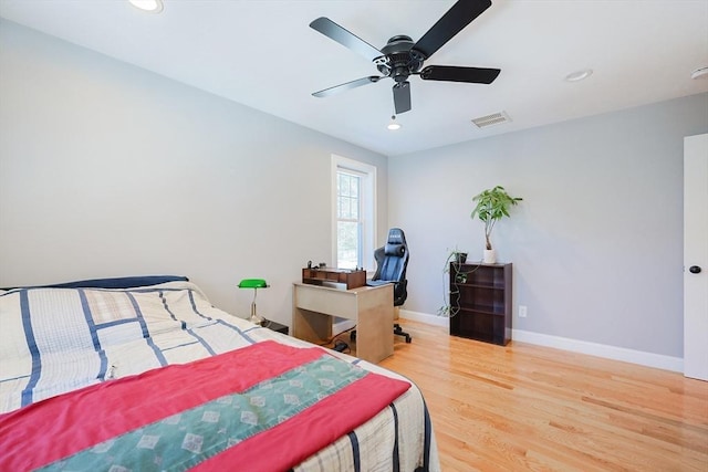 bedroom featuring recessed lighting, wood finished floors, a ceiling fan, visible vents, and baseboards