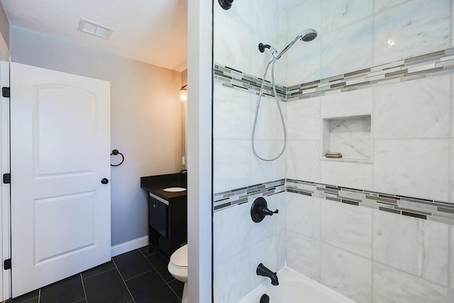 bathroom featuring bathing tub / shower combination, visible vents, toilet, vanity, and tile patterned floors