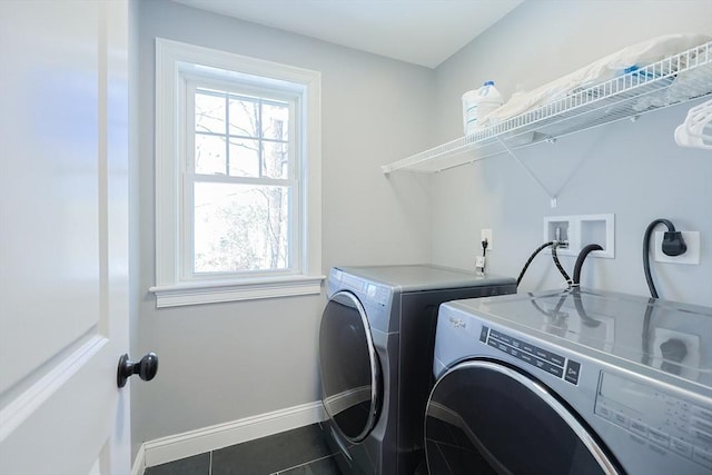 laundry room featuring laundry area, a wealth of natural light, and washer and dryer