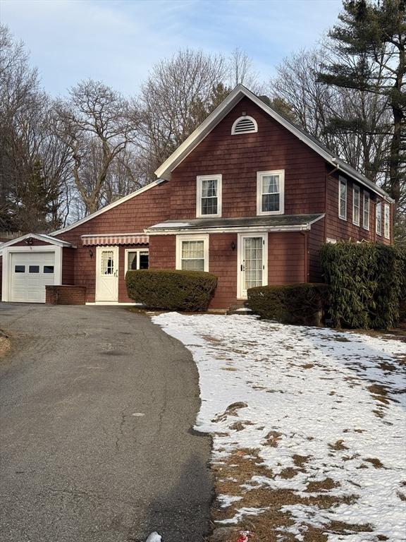 view of front of property with an outbuilding and a garage