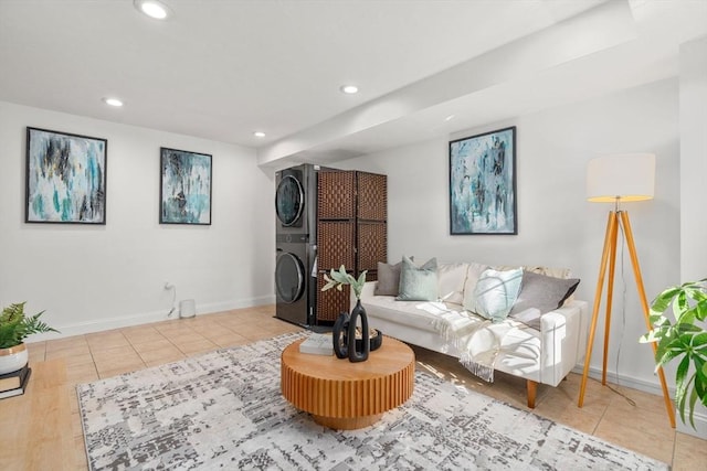 tiled living room featuring stacked washing maching and dryer