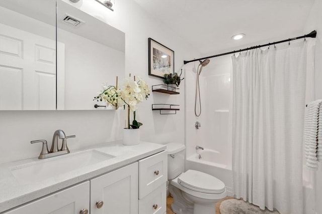 full bathroom with vanity, shower / bath combination with curtain, and toilet