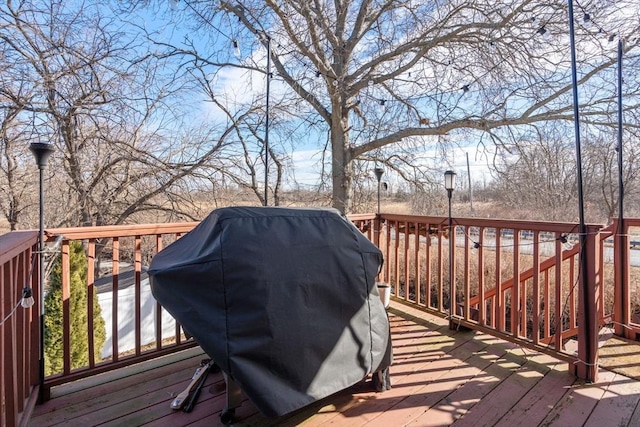 wooden deck with grilling area