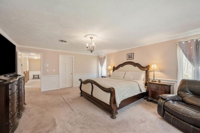bedroom featuring a chandelier, wainscoting, light carpet, and ornamental molding