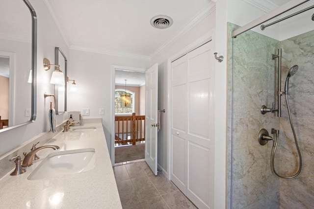 bathroom featuring a stall shower, ornamental molding, double vanity, and tile patterned floors