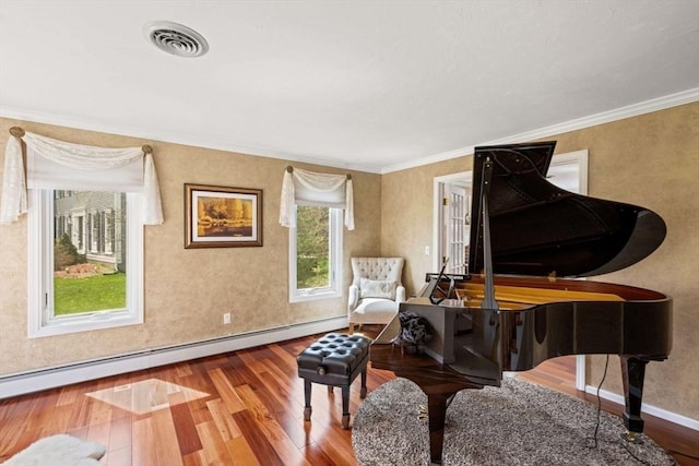 living area featuring wood finished floors, a baseboard radiator, ornamental molding, and baseboards