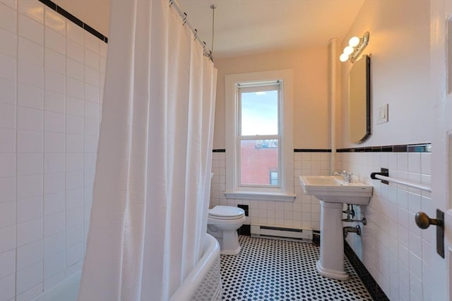 857 Beacon St Unit 51, Boston, MA 02215 - full bath featuring a baseboard heating unit, tile walls, toilet, shower / bath combo, and a wainscoted wall