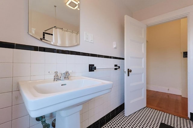 857 Beacon St Unit 51, Boston, MA 02215 - full bathroom featuring tile walls, a sink, and wainscoting