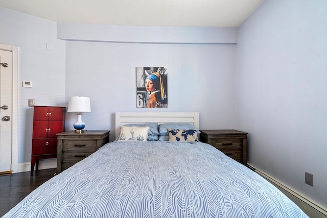 bedroom featuring dark hardwood / wood-style flooring and a baseboard radiator