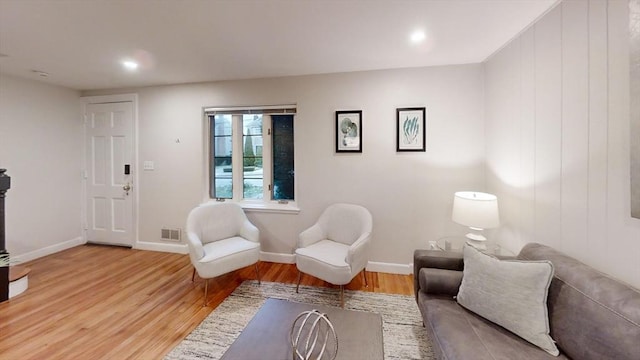 sitting room featuring hardwood / wood-style floors