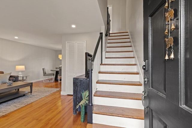 staircase with wood-type flooring