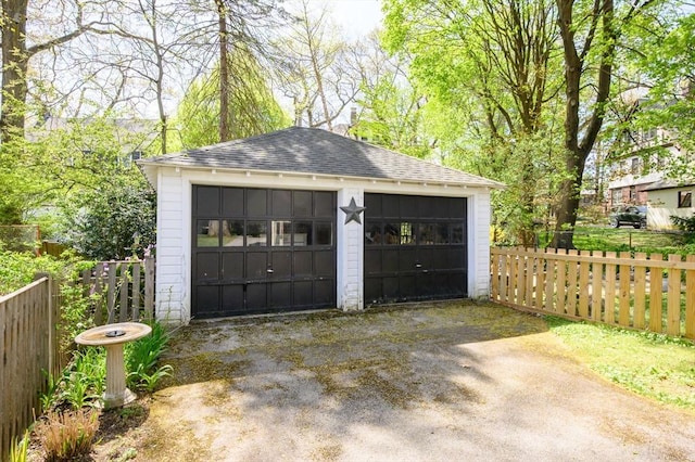 detached garage with fence