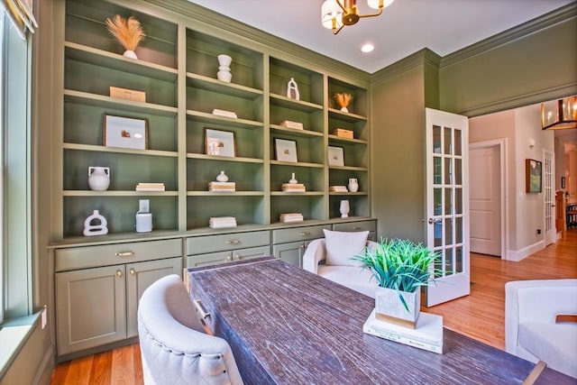 interior space with a chandelier and light hardwood / wood-style flooring