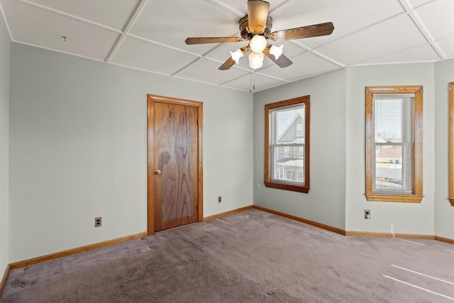 unfurnished bedroom featuring ceiling fan, baseboards, and carpet