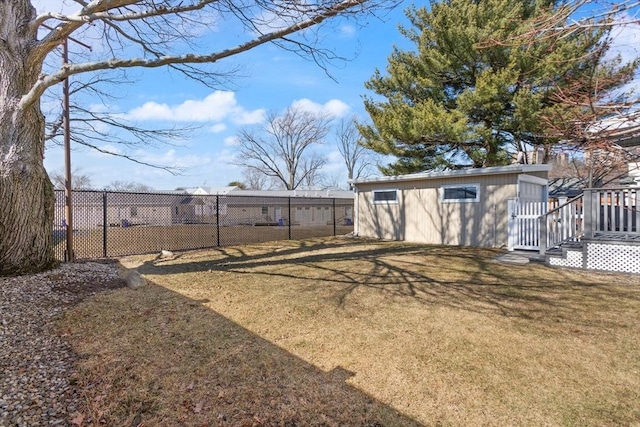 view of yard with an outbuilding and fence