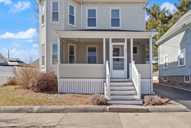 view of front facade with a porch and driveway