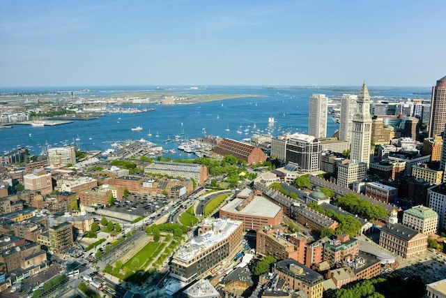 birds eye view of property featuring a water view and a city view