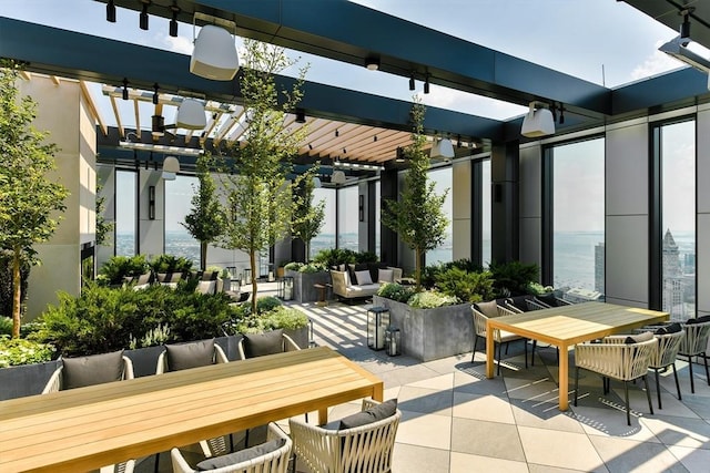 view of patio / terrace with outdoor dining area and a pergola