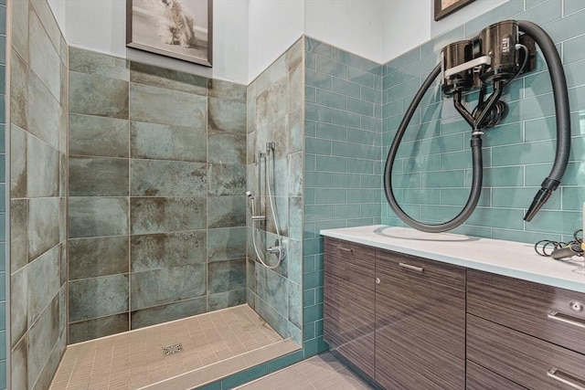 full bath featuring a walk in shower and vanity