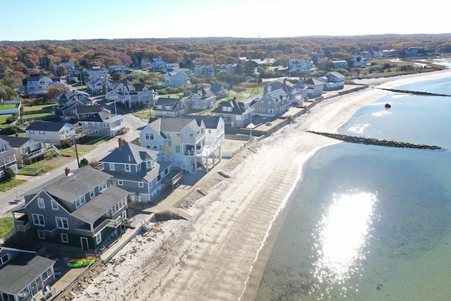 birds eye view of property featuring a view of the beach and a water view