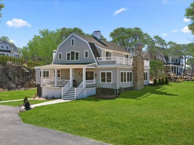 572 Jerusalem Rd, Cohasset, MA 02025 - shingle-style home featuring covered porch, a chimney, and a front lawn