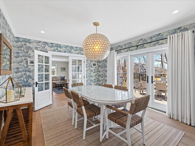 572 Jerusalem Rd, Cohasset, MA 02025 - dining space featuring french doors, wallpapered walls, ornamental molding, light wood-type flooring, and recessed lighting